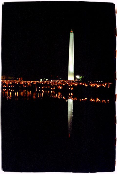 Washington Monument in the Reflecting Pool [National AIDS Candlelight Vigil and March #96]. Brent Pruitt. 35mm photograph, 1996